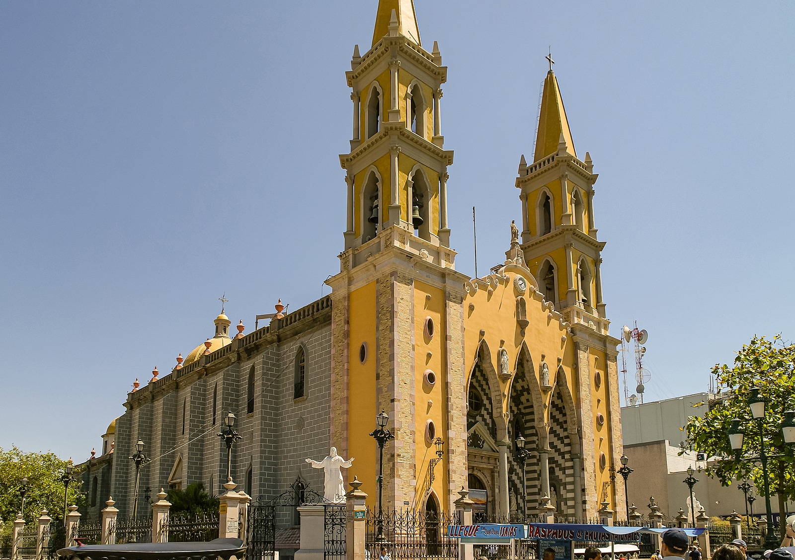 Yellow Cathedral Basilica of the Immaculate Conception against blue sky.