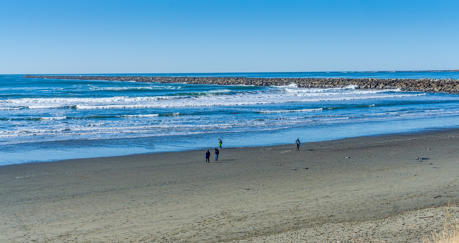 Waves roll in along the jetty in Westport, Washington.